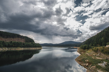 Fototapeta na wymiar Lake, mountains, forest,amazing landscapes, rainy sky,forrest, cloudy, dramatic,scenic
