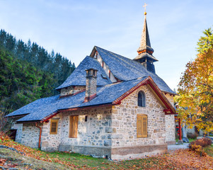 Fototapeta na wymiar Old and small church in nature countryside with autumn season background, Outdoor church in countryside in the fall.
