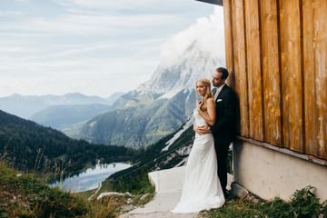 Wonderful wedding couple in the Alps  - obrazy, fototapety, plakaty