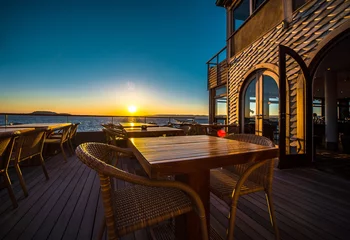 Photo sur Plexiglas Mer / coucher de soleil Outdoors restaurant at sunset