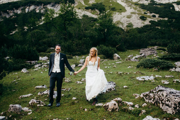 Beautiful bride and groom in the forest at summer 