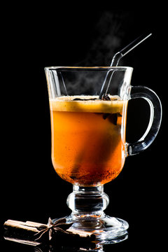 Hot Buttered Becherovka cocktail with honey, cinnamon and anise with steam