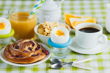 Soft boiled chicken egg, coffee, baking, muesli and orange juice