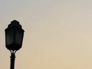 Vintage street Light Lamp dark in evening sky with space for message or object