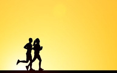 Silhouette of woman running on blurry sunset background.