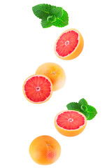 Isolated flying grapefruits with mint