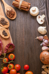 spices and vegetables for cooking on a wooden table