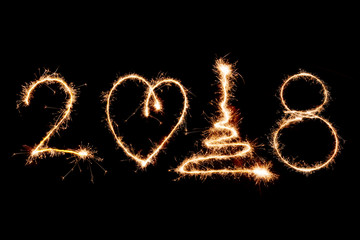2018 written with Sparkle firework on black background, happy new year 2018 concept