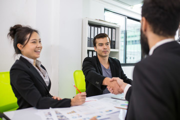 Businessman shaking hands after finished meeting.