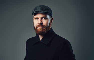 Obraz premium A man with redbeard over grey background.