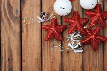 Christmas background with festive decorations on a dark wooden Board, the composition of the Christmas baubles, red sta
