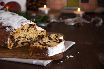 Sliced Christmas Stollen. Traditional german christmas cake with dried fruits and icing sugar