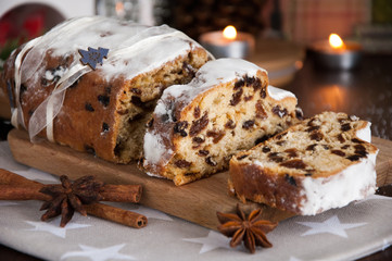 Sliced Christmas Stollen. Traditional german christmas cake with dried fruits and icing sugar
