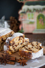 Sliced Christmas Stollen. Traditional german christmas cake with dried fruits and icing sugar