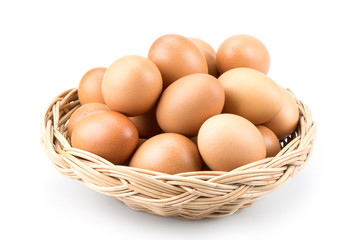 Eggs in mini rattan basket , isolated on white background
