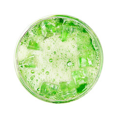 Green soda cold drink with ice and bubble isolated on white background