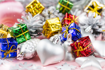 Colorful Christmas ornaments close up on a pastel background