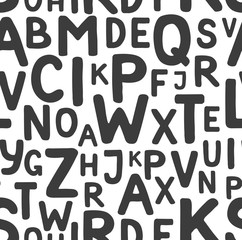 Seamless pattern of black letters of the Latin alphabet on a white background
