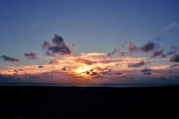 pink sunrise with clouds on the atlantic ocean