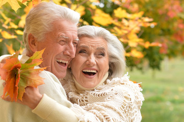  caucasian senior couple with leaves 
