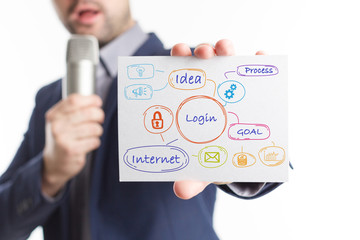 The concept of business, technology, the Internet and the network. Young businessman showing inscription: Login