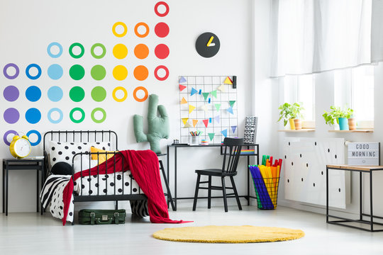 Colorful kid's bedroom with clock