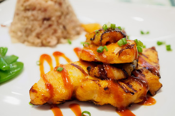 Grilled chicken steak with spicy sauce and rice