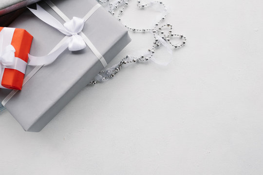 luxury jewelry gifts for top class on grey background. professional present wrapping for toffs on birthday, new year, christmas, thanksgiving, valentines day and other holidays.