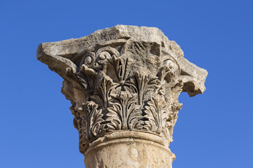 Closeup of a top of a roman column in the ruins of the old city of Jerash in Jordan
