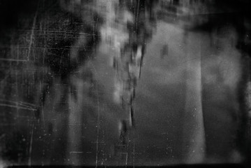 Black and White Blurry GrungeTexture Dirty Surface. Dark Tonality.