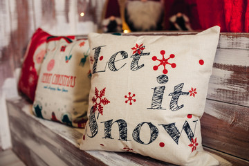 pillow with the inscription: "Let it snow".