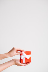 Red gift box with a present for a lover on a Valentine's day on white background. Love and passion concept