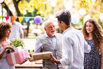 Naklejka premium Family celebration or a garden party outside in the backyard.