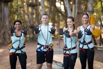 Portrait friends wearing protective gloves