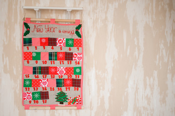 Soft textile Christmas calendar on the wall