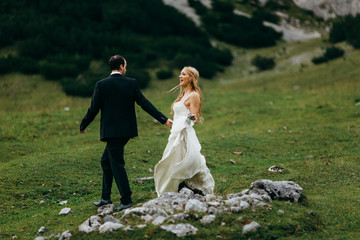 Happy bride and groom in the Alps 