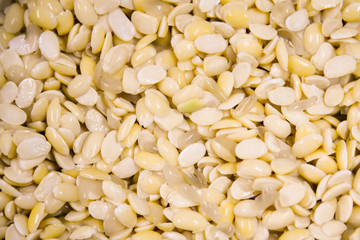 Soybean background.yellow bean washed prepare for making tofu soy milk.yellow soaked peas texture.