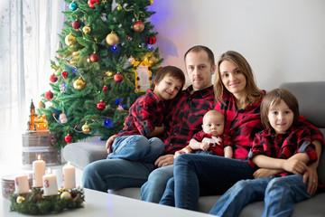 Happy family portrait on Christmas, mother, father and three children