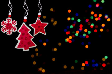 Collection of Christmas felt ornaments on light bokeh background. Star snowflake and Christmas tree