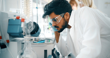 Attractive student of chemistry working in lab
