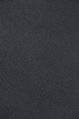 Dark grey new clean rubber bumpy texture background. Even and highly detailed.