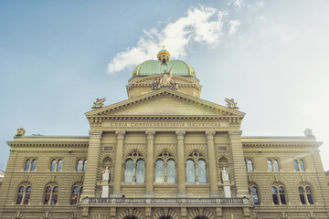 Fototapeta na wymiar Bern, Switzerland - October 30, 2017: The Federal Palace, which is the seat of Federal Parliament (Swiss Federal Assembly), is located in a large building which dominates this part of the city.