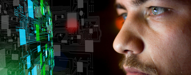 Young man in front of circuit board architecture - technology concept