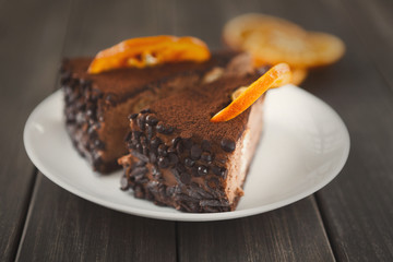 Chocolate cake with cream and profiterole
