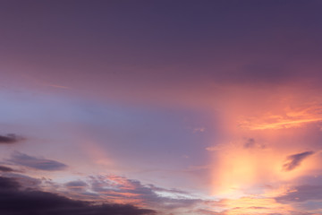 Long exposure of nautical twilight sky as orange and purple tone in evening time