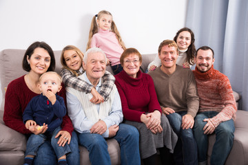 Friendly large family making numerous photos