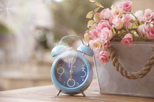 Blue clock with Artificial Flowers