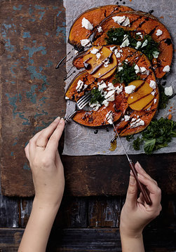 Baked Pumpkin with kale, persimmon and feta