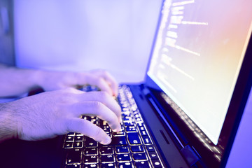 Male Hands Typing Code On Laptop Closeup