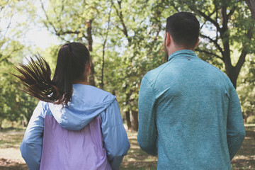 Back view running two young people.